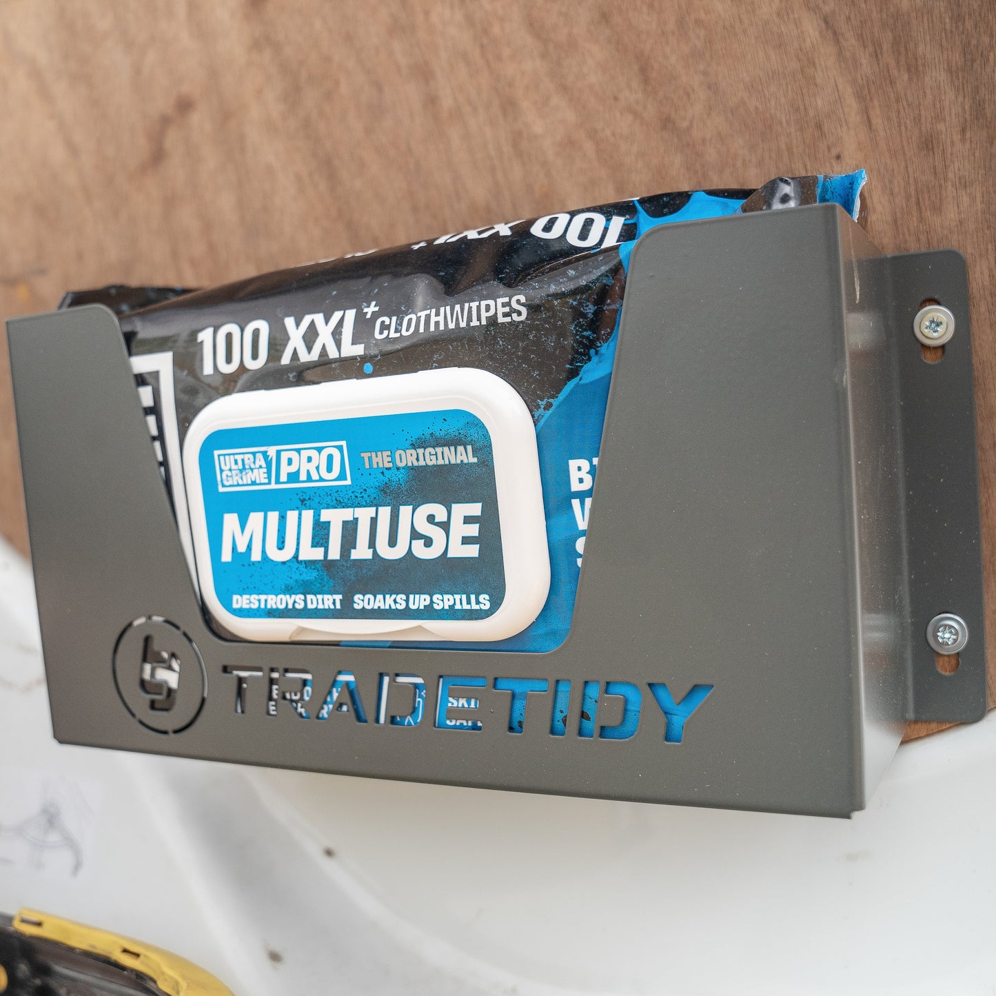 Black Ultragrimes Wipes in a Garay Wipes Holder Mounted on a Wooden Wall